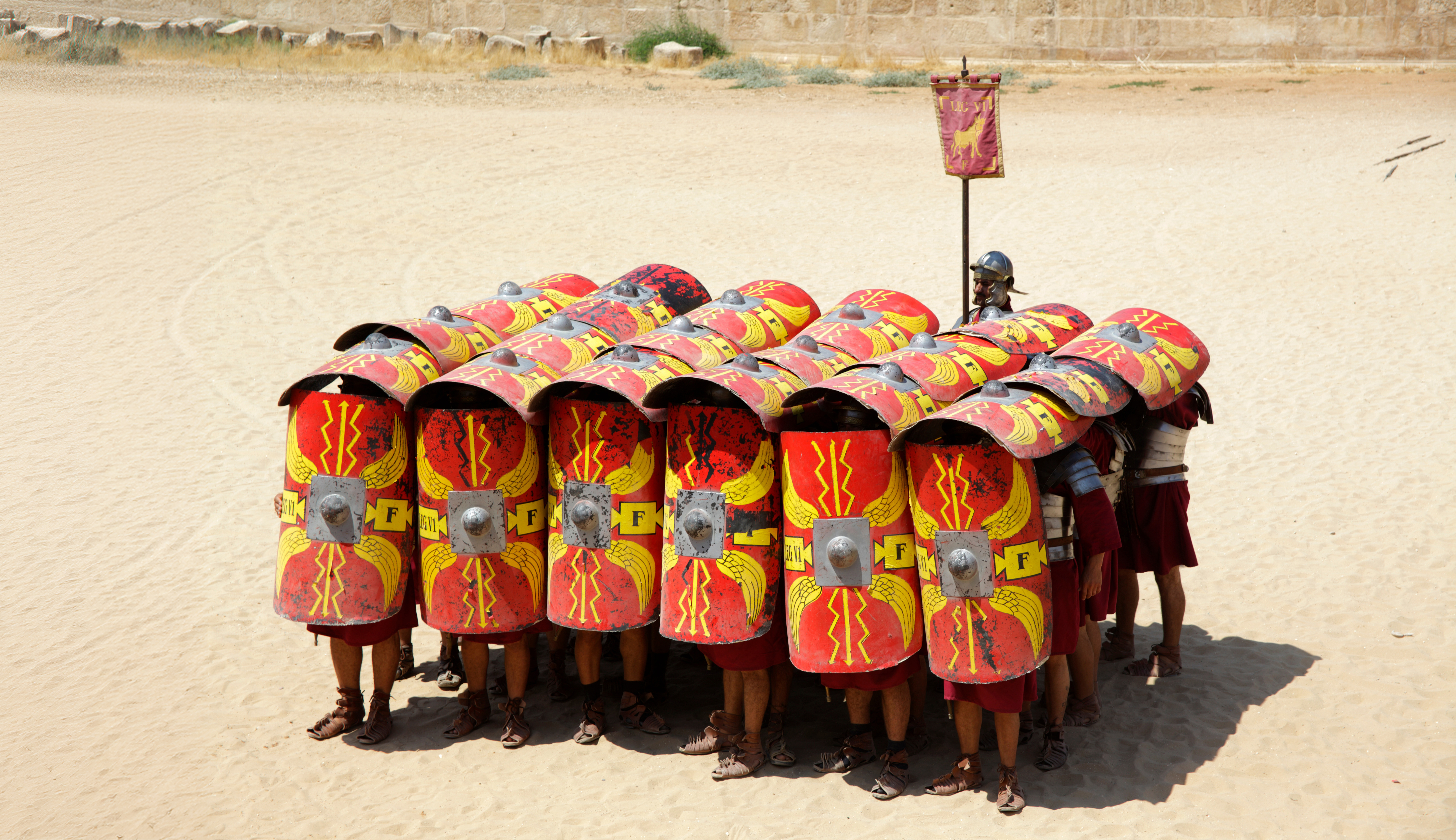 Romans protecting themselves with shields as a analogy for protecting the franchise brand