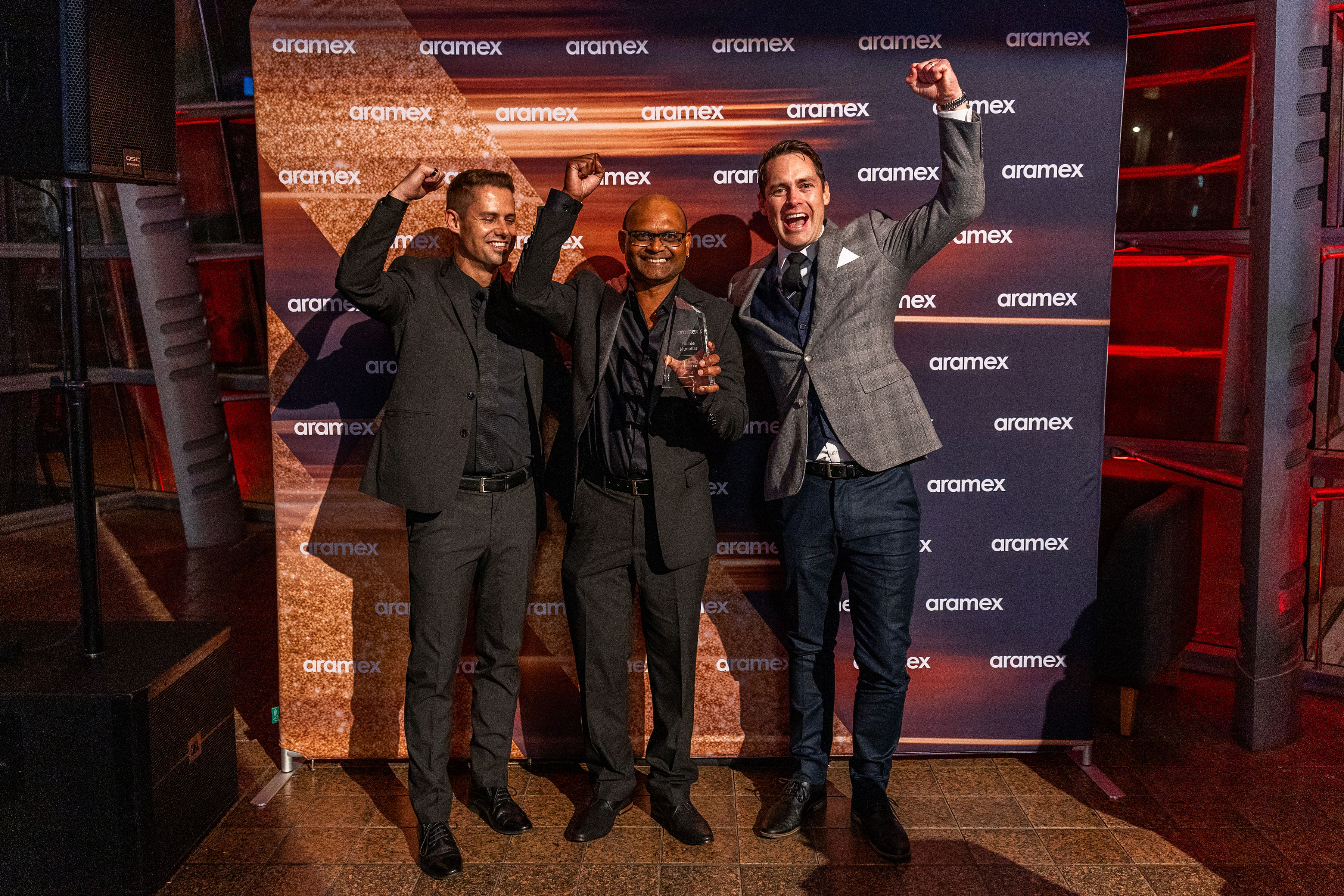 Richie Mudaliar (centre) was thrilled with his Courier Franchisee of the Year award